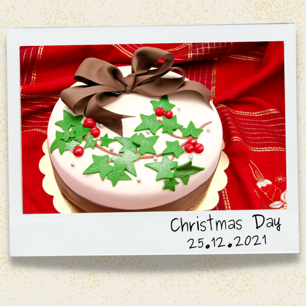 Poloroid of beautiful homemade Christmas Cake with handwritten text - Christmas Day 25/12/2021.