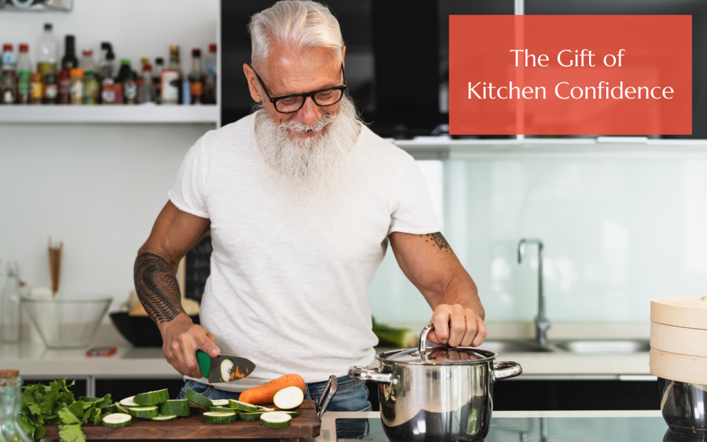 Image: Older man, happy and cooking in modern kitchen. Text Reads: The Gift of Kitchen Confidence.
