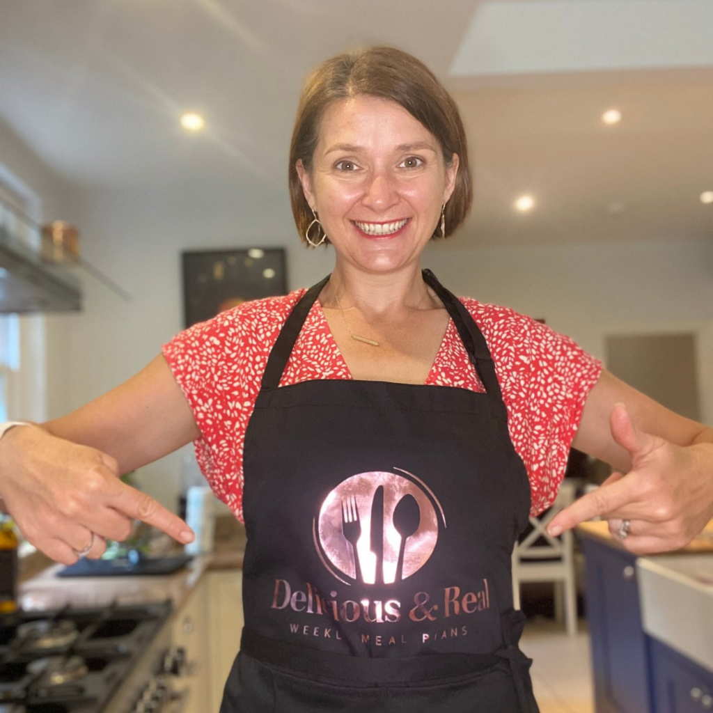 Image of Claire with Delicious & Real Apron.