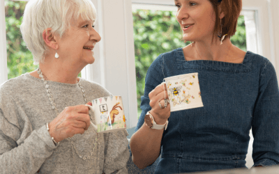 Mum and Daughter together in kitchen, having a tea and chat.