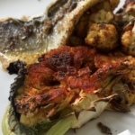 Pan fried sea-bass with cauliflower steaks